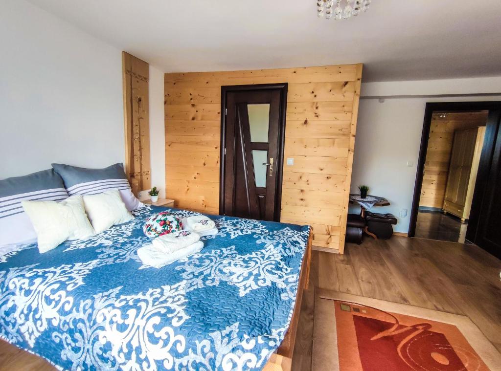 Posteľ alebo postele v izbe v ubytovaní Szostak Apartament