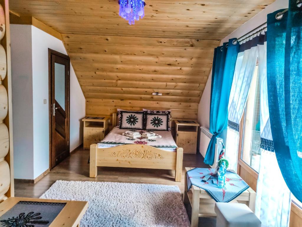 Posteľ alebo postele v izbe v ubytovaní Szostak Apartament