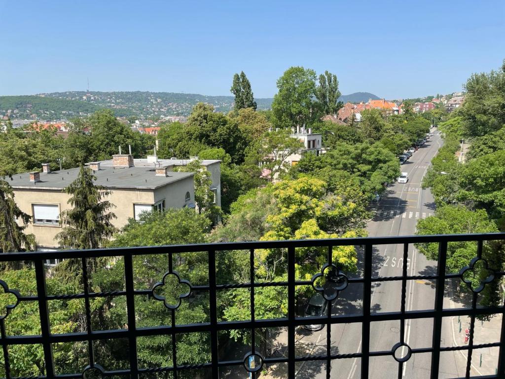 a view of a street from a balcony at Panoramic Hideaway in Central Buda in Budapest