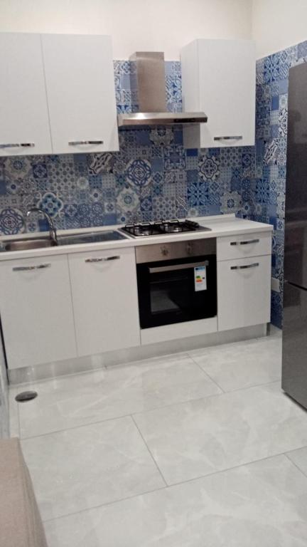 Kuchnia lub aneks kuchenny w obiekcie Nase e cane home Napoli