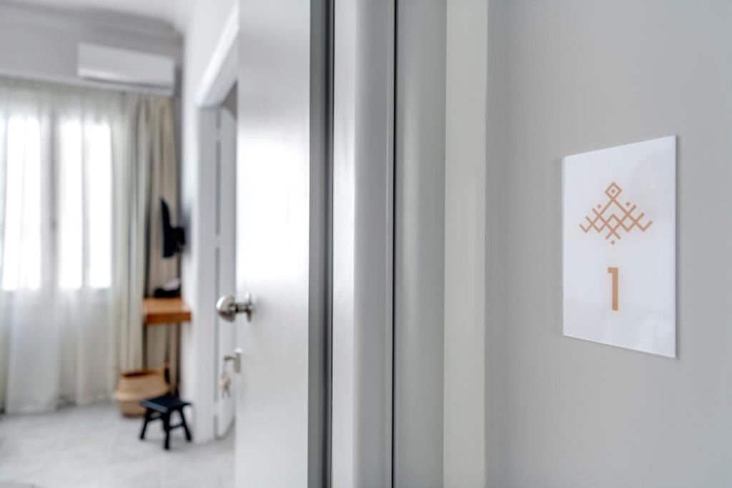 TV a/nebo společenská místnost v ubytování Nomadic Cozy Rooms