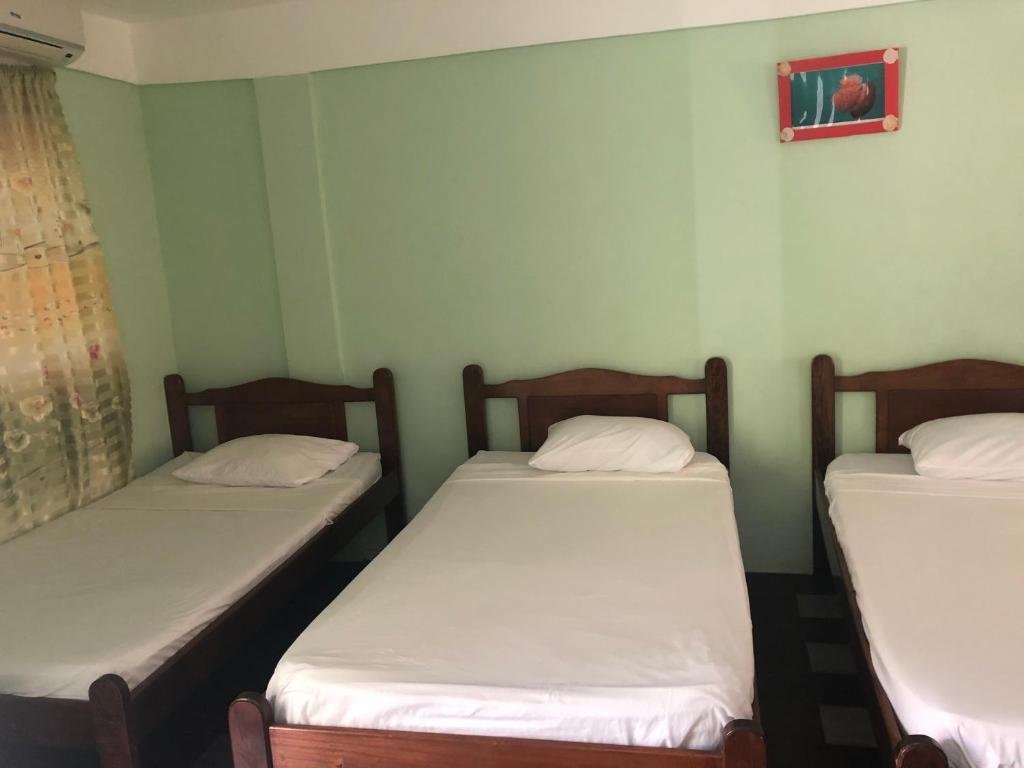 Postel nebo postele na pokoji v ubytování Sea World Vacation Home