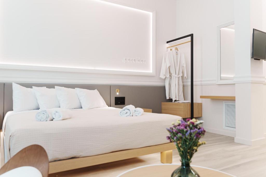 Posteľ alebo postele v izbe v ubytovaní Agora Athens Suites