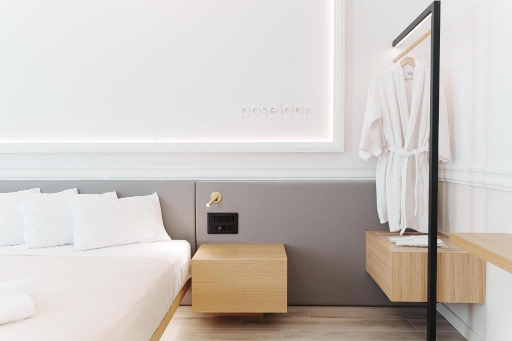 Posteľ alebo postele v izbe v ubytovaní Agora Athens Suites