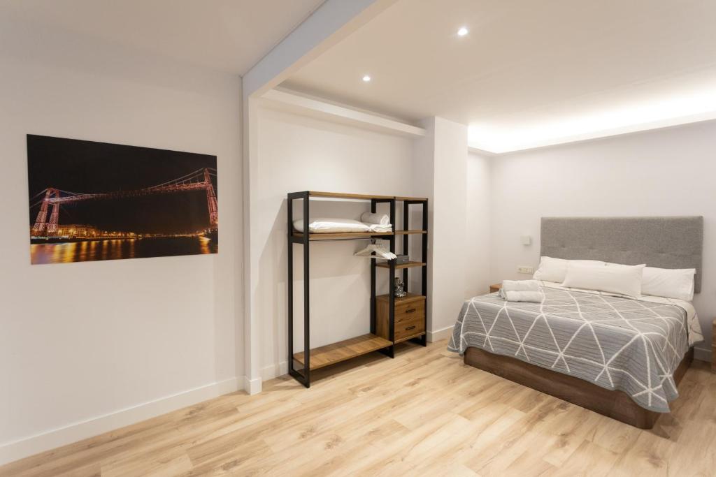 A bed or beds in a room at APARTAMENTOS ARRIET