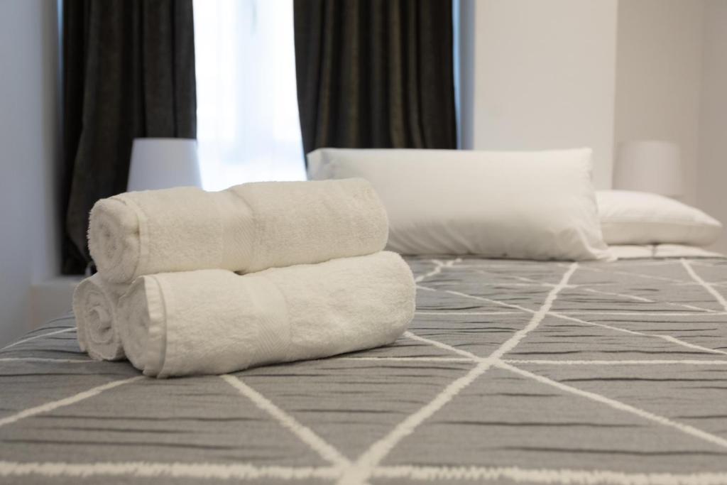 A bed or beds in a room at APARTAMENTOS ARRIET
