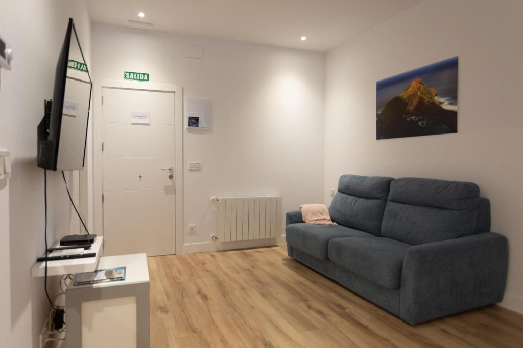 A television and/or entertainment centre at APARTAMENTOS ARRIET