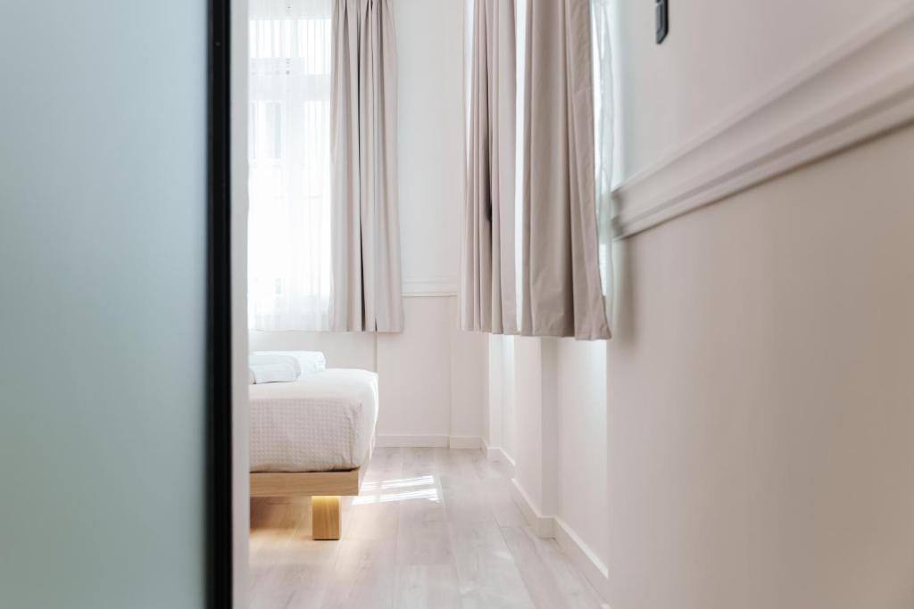 Posteľ alebo postele v izbe v ubytovaní Agora Athens Suites