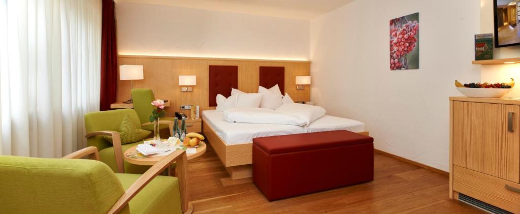 Postel nebo postele na pokoji v ubytování Wellnesshotel Ludinmühle