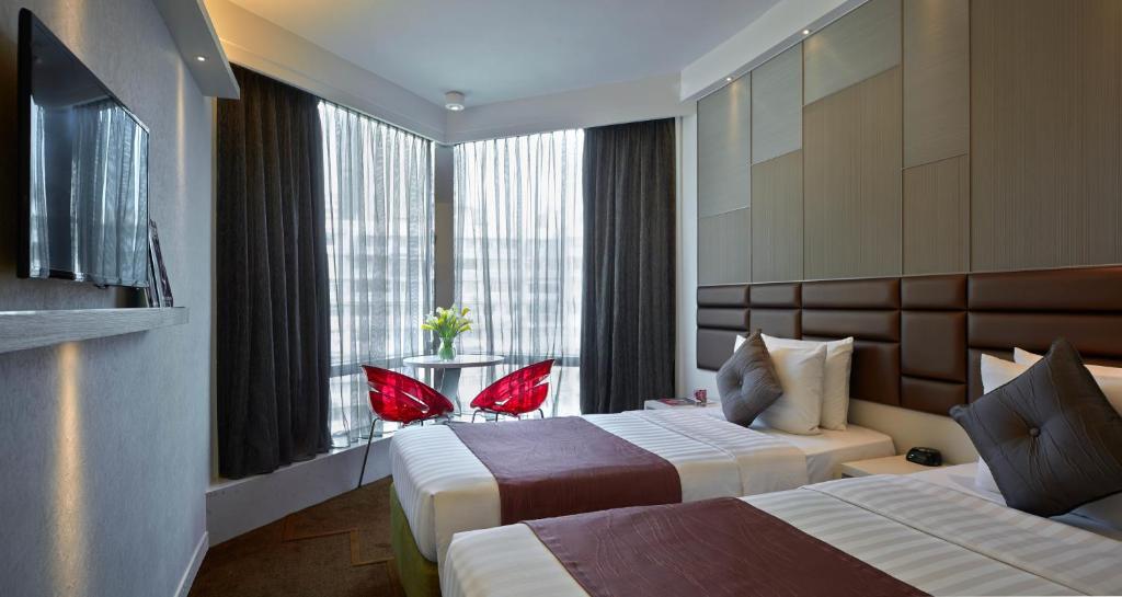 Voodi või voodid majutusasutuse Stanford Hotel Hong Kong toas