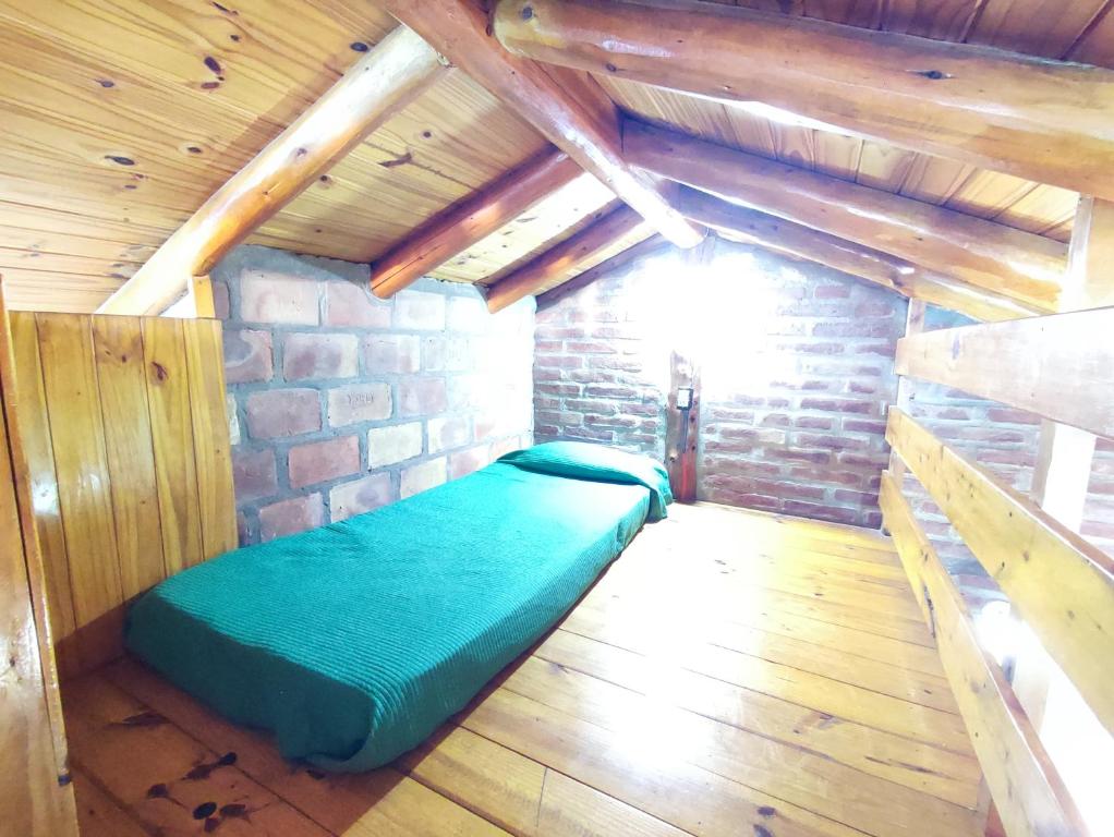 Postel nebo postele na pokoji v ubytování Cabañas Los Lúpulos