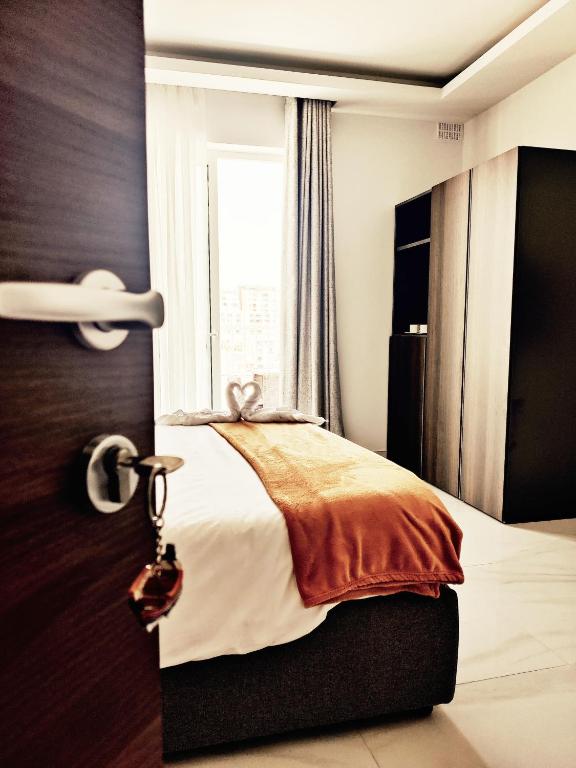 Postel nebo postele na pokoji v ubytování SouthShore Accommodation