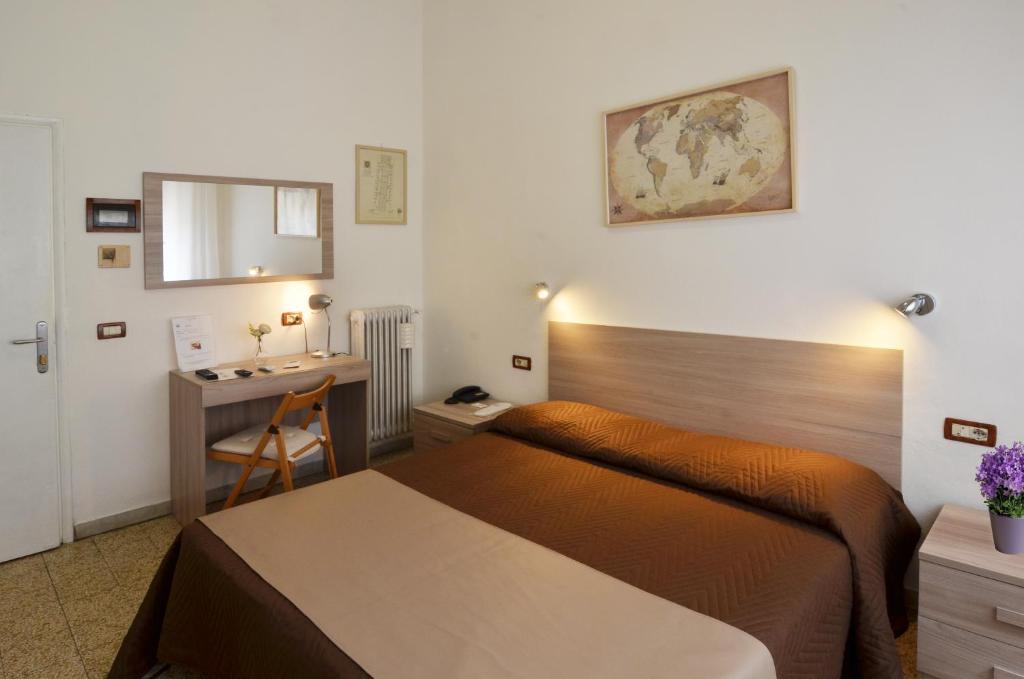 Postel nebo postele na pokoji v ubytování Hotel La Torre