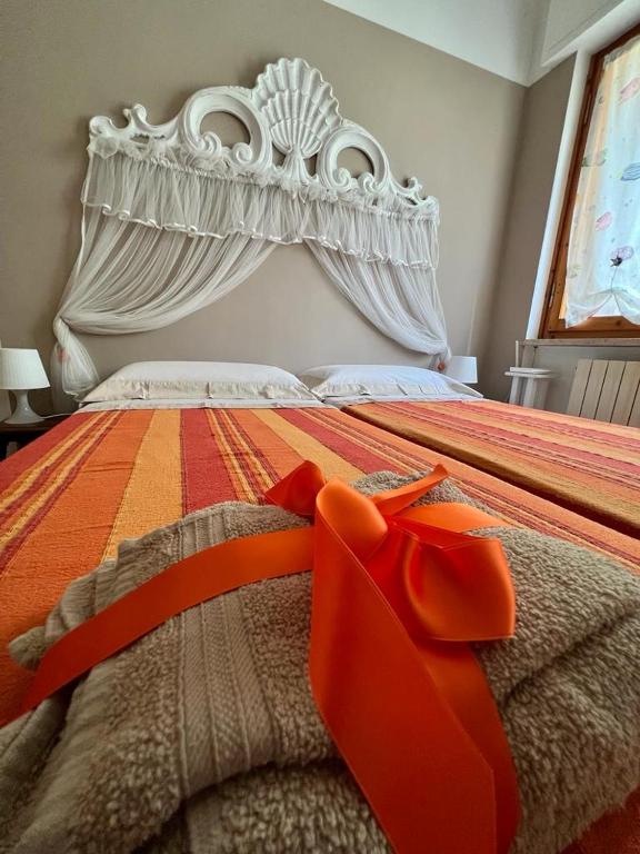 Łóżko lub łóżka w pokoju w obiekcie villino Morena