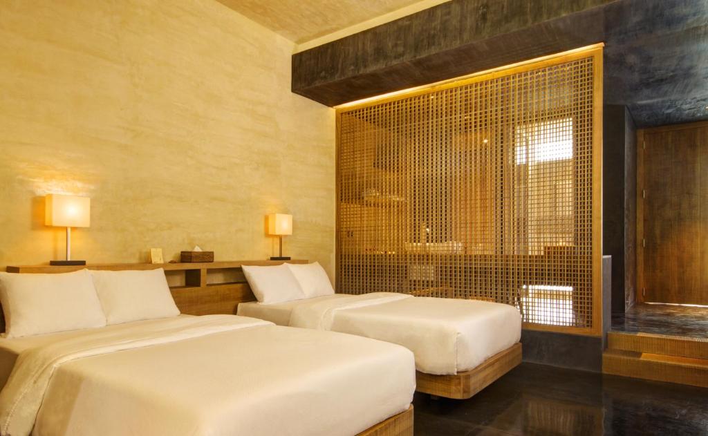 Postel nebo postele na pokoji v ubytování Amorita Resort Bohol