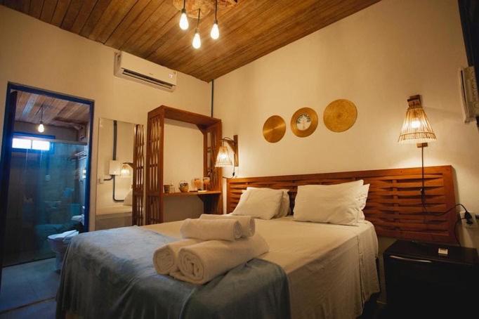 Ein Bett oder Betten in einem Zimmer der Unterkunft Tapiri Pousada - Rota Ecológica dos Milagres