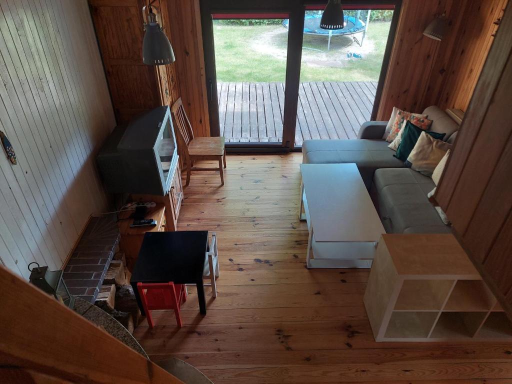 Televízia a/alebo spoločenská miestnosť v ubytovaní Zacisze
