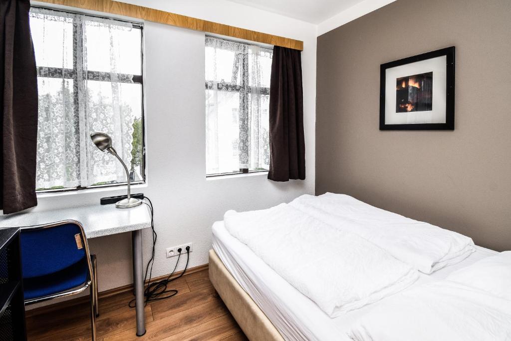 Postel nebo postele na pokoji v ubytování Guesthouse Aurora