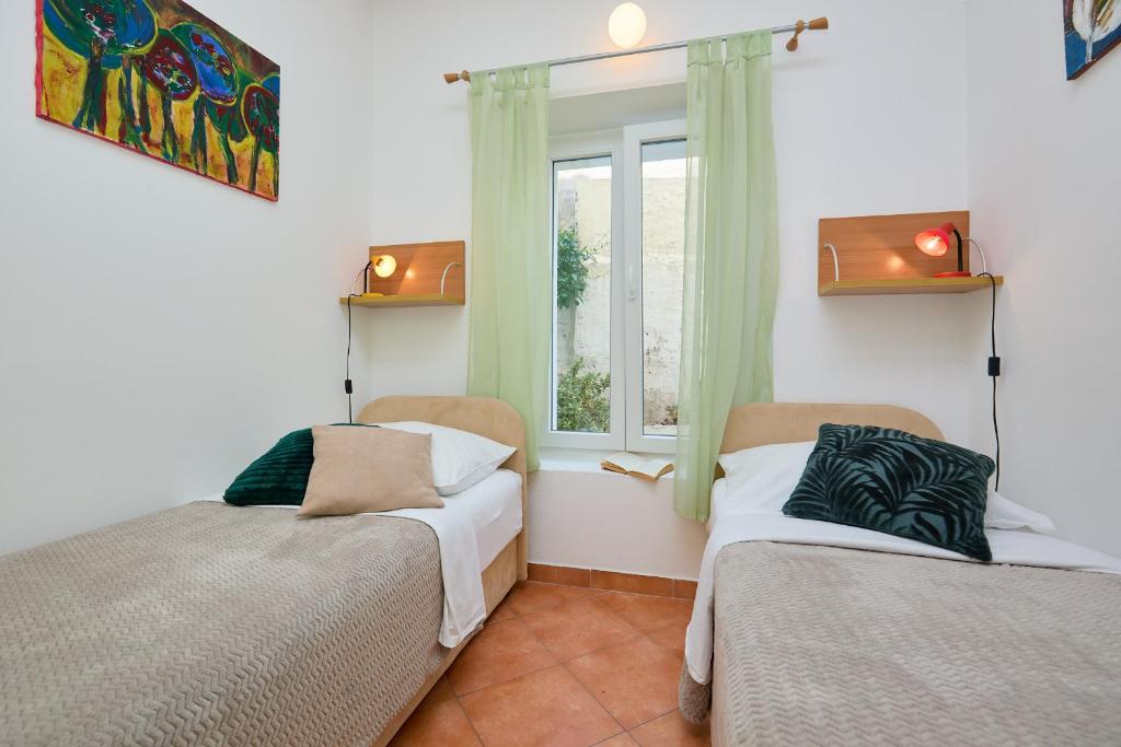 Postel nebo postele na pokoji v ubytování Apartment Furmus A26