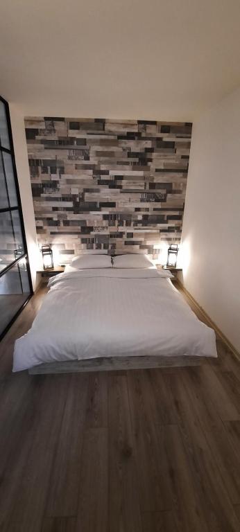 Ένα ή περισσότερα κρεβάτια σε δωμάτιο στο The World Apartament
