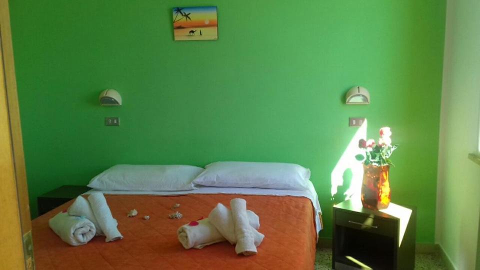 Postel nebo postele na pokoji v ubytování Hotel Acapulco sul mare