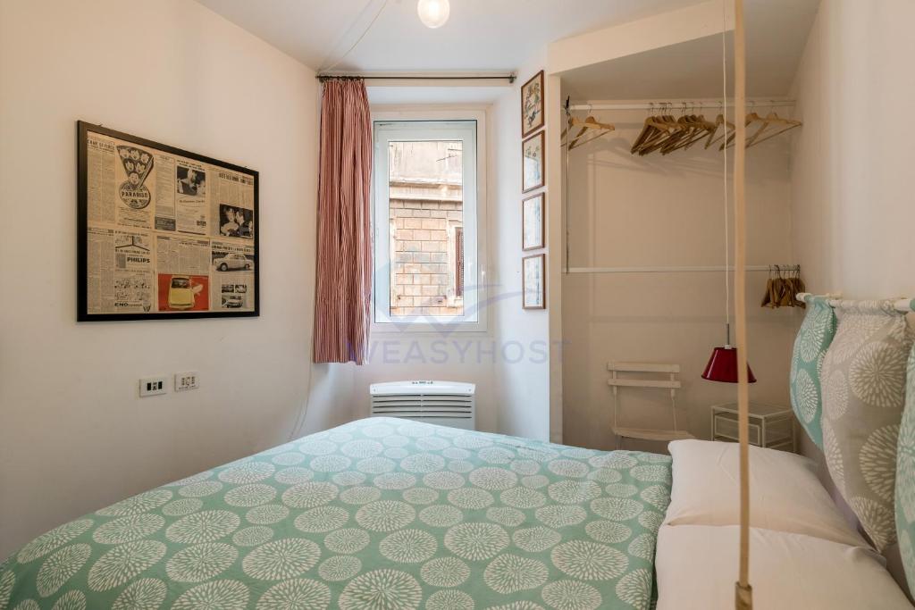 Posteľ alebo postele v izbe v ubytovaní Cozy Entire Apt Close to Piazza Trilussa