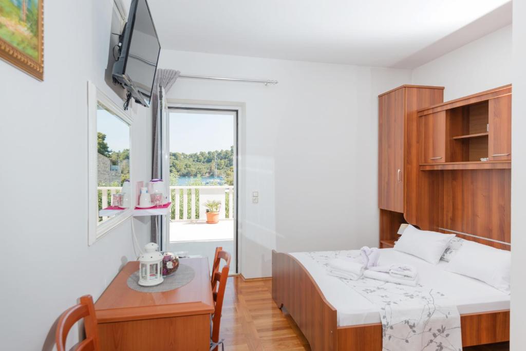 Postel nebo postele na pokoji v ubytování Guesthouse Sanela