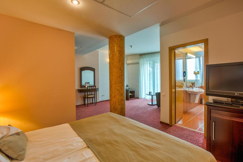 Postel nebo postele na pokoji v ubytování Hotel Ambient