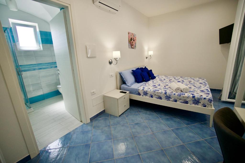 Postel nebo postele na pokoji v ubytování Relais Villa Ettore