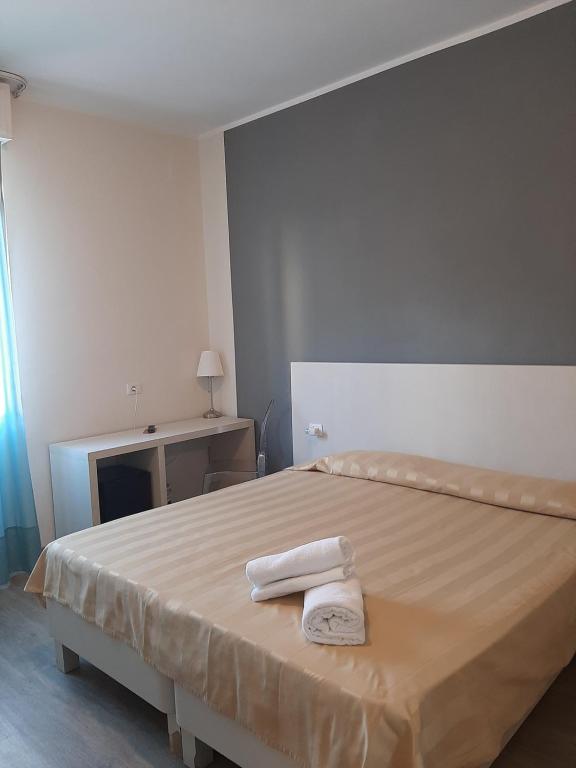Postel nebo postele na pokoji v ubytování Mio Hotel Firenze