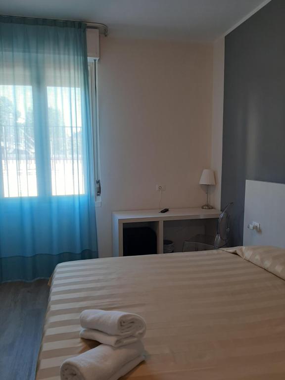 Postel nebo postele na pokoji v ubytování Mio Hotel Firenze