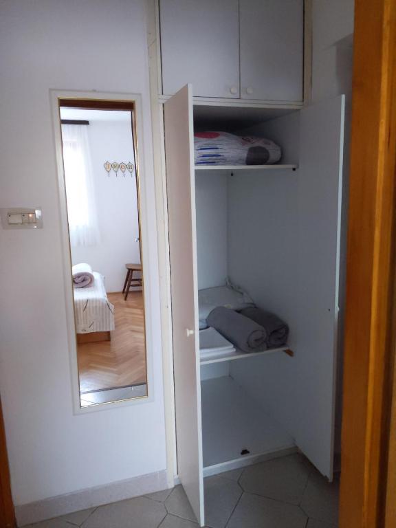 Postel nebo postele na pokoji v ubytování Apartment Fugosic