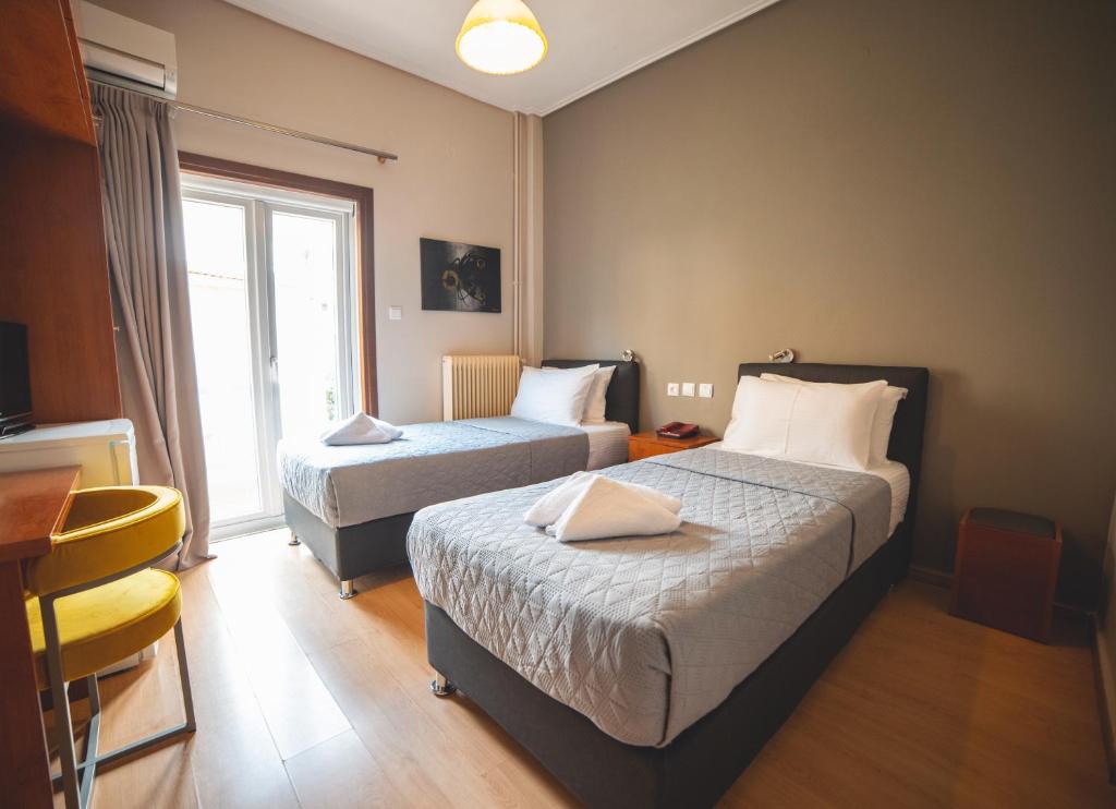 Postel nebo postele na pokoji v ubytování Hotel Galaxy