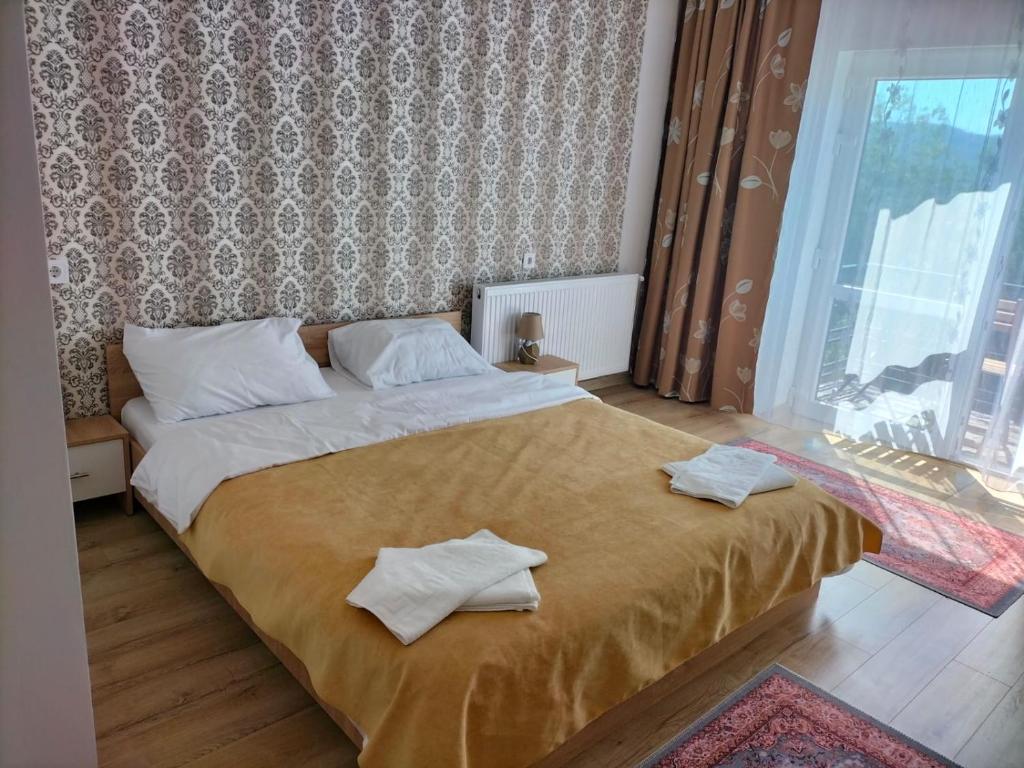 Postel nebo postele na pokoji v ubytování Conacul Doamnei Nucșoara