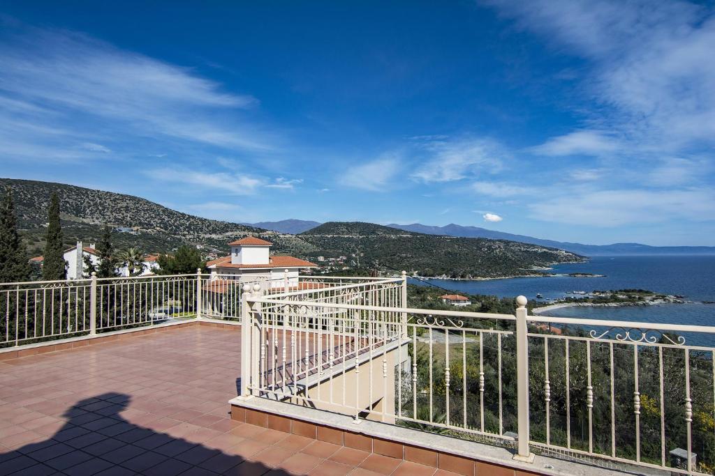 a balcony with a view of the water at Marathos Sea View Apartments in Marathos