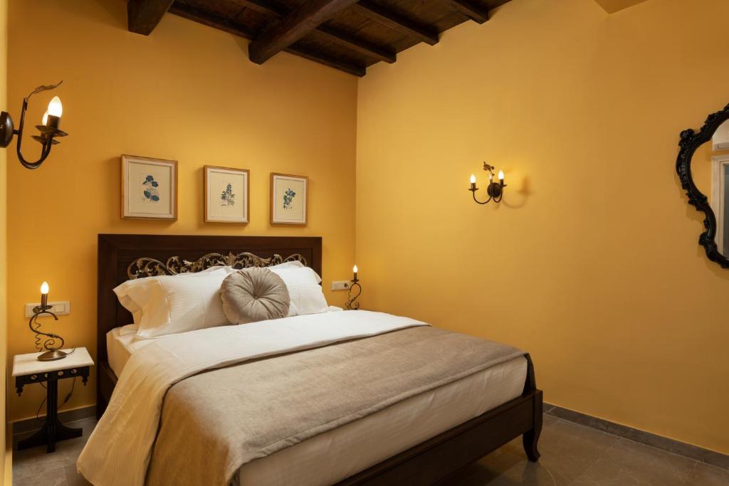 Postel nebo postele na pokoji v ubytování Nobili Boutique Hotel