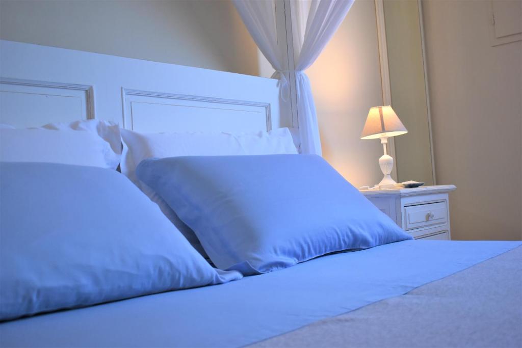 Postel nebo postele na pokoji v ubytování B&B Li Ccoti