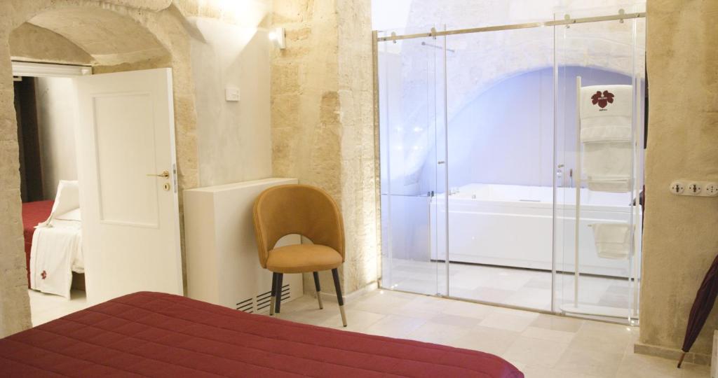 Postel nebo postele na pokoji v ubytování ENOTRIO Barisano
