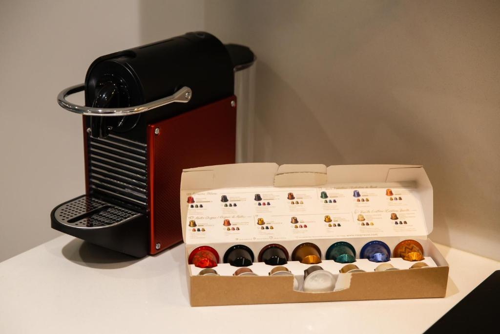 a box of chocolates sitting next to a sewing machine at Atrium Areias in Viana do Castelo