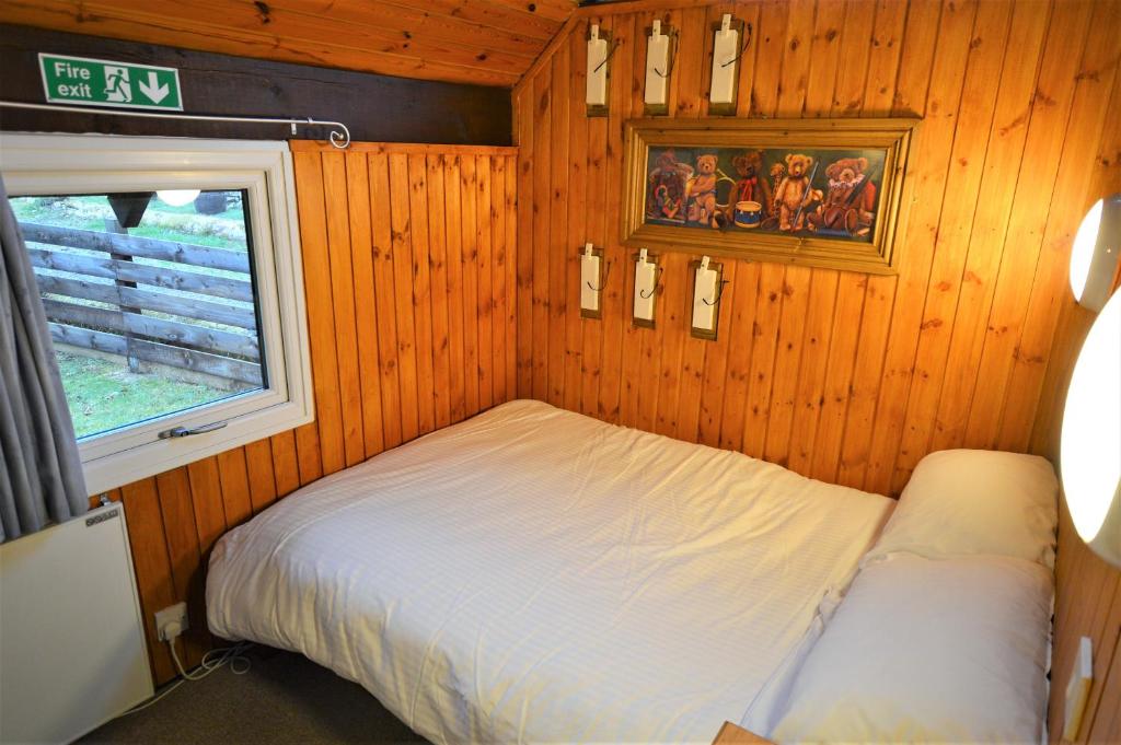Postel nebo postele na pokoji v ubytování Iona Lodge