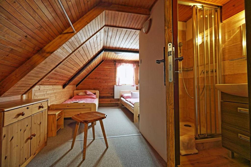 Postel nebo postele na pokoji v ubytování Penzion a Restaurace U Paseků