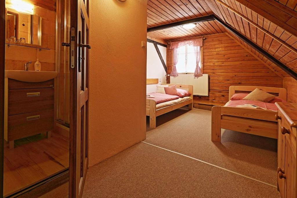 Postel nebo postele na pokoji v ubytování Penzion a Restaurace U Paseků