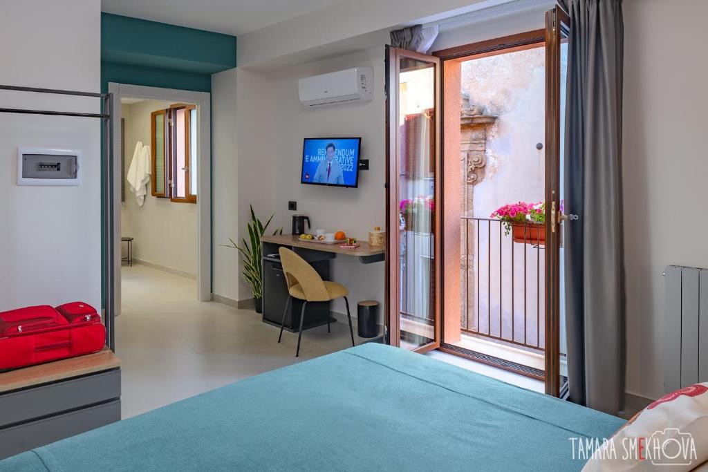 Postel nebo postele na pokoji v ubytování Macramè Fazello Rooms
