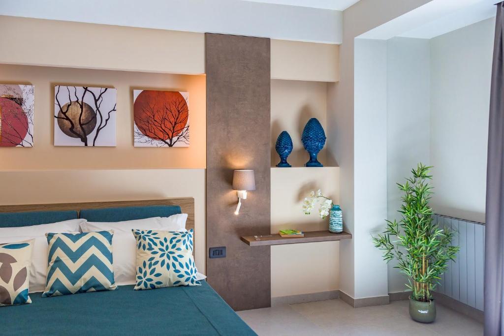 Postel nebo postele na pokoji v ubytování Macramè Fazello Rooms