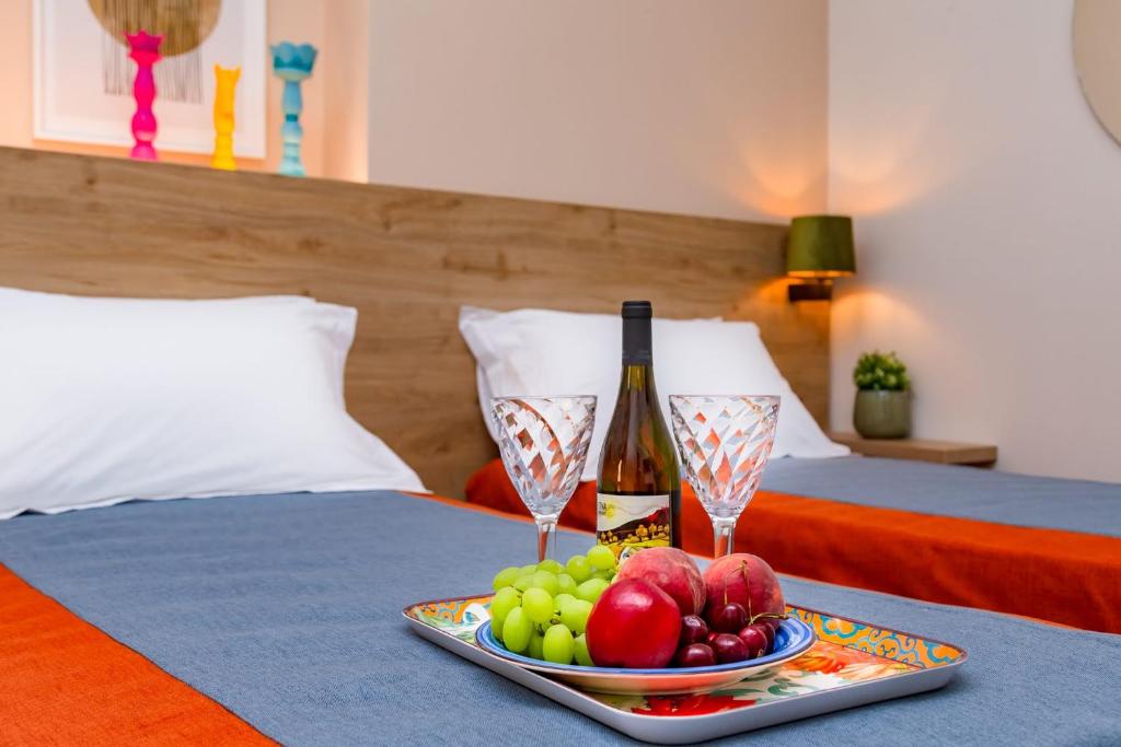 Postel nebo postele na pokoji v ubytování Macramè Fazello Rooms