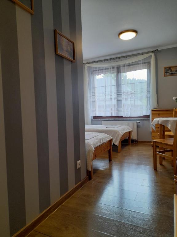 Posteľ alebo postele v izbe v ubytovaní EMAR