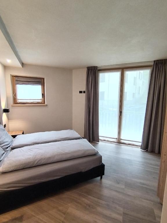 Łóżko lub łóżka w pokoju w obiekcie Chalet MAOL Luxury Living