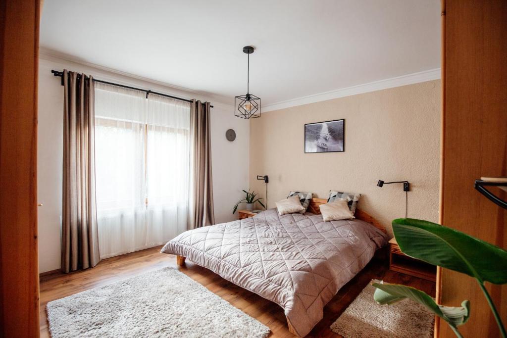 Posteľ alebo postele v izbe v ubytovaní Csendeskert Wellness Apartments - Garden, grill, chill