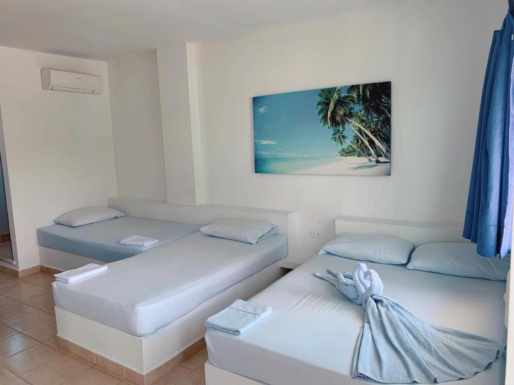 Postel nebo postele na pokoji v ubytování Blue Apartahotel