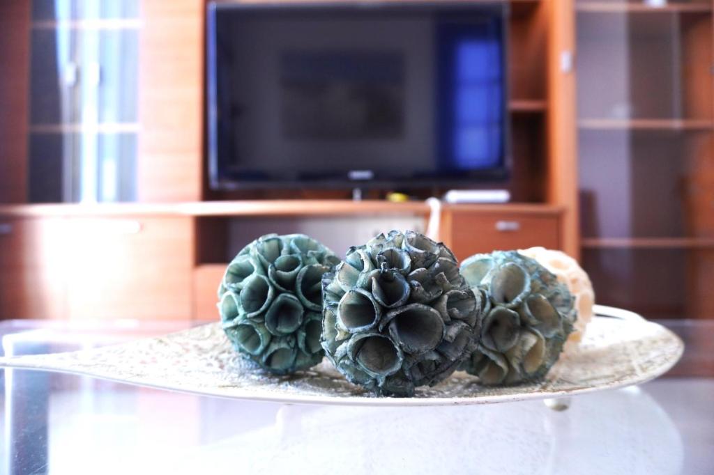 A television and/or entertainment centre at Apto. Guacimeta, a 20m de la playa.